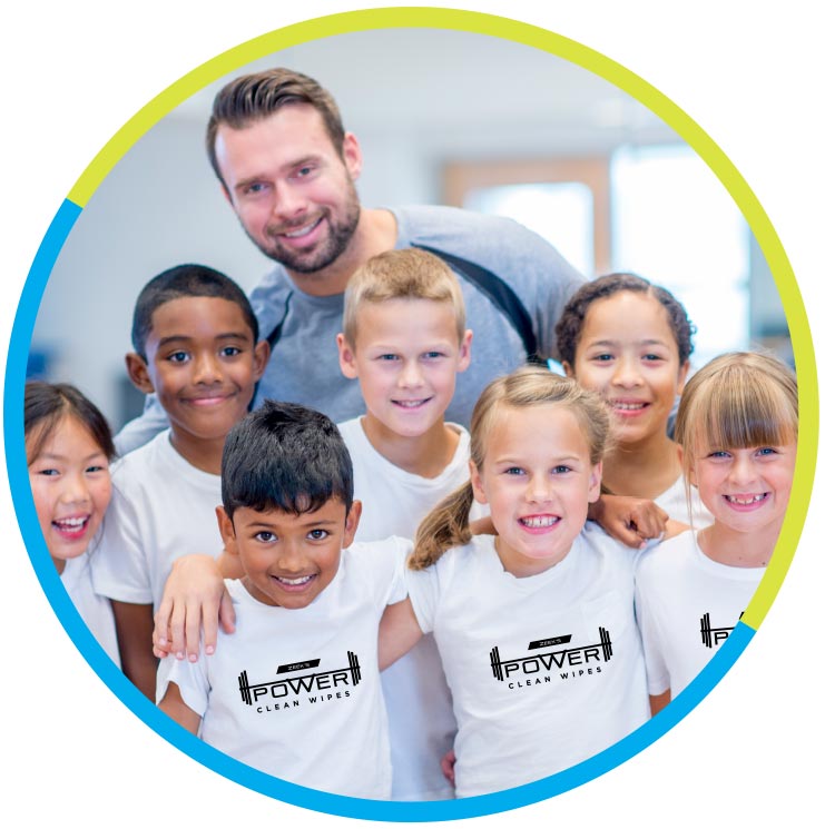 Zeek's Power Clean Wipes representative standing with group of kids wearing Zeek's Power Clean Wipes t-shirts.